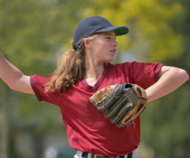 girl throwing baseball