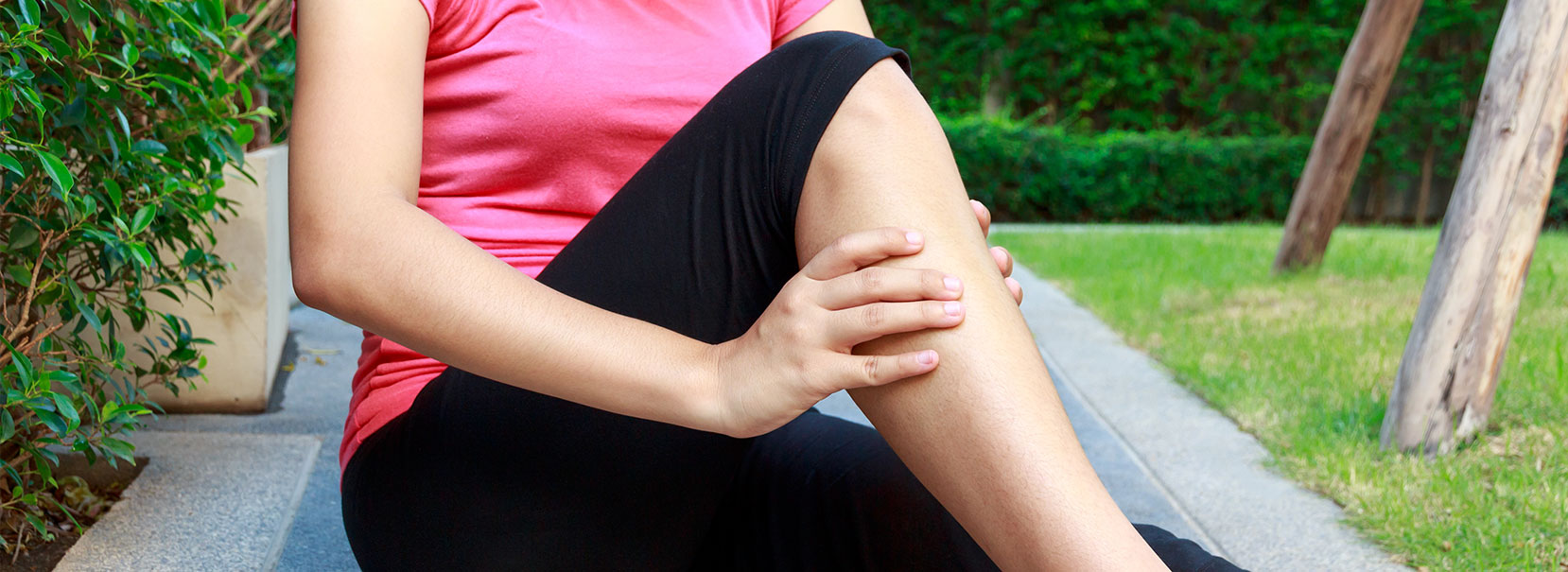 Woman massaging her calf - When to worry about leg cramps