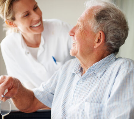 Patient discussing stroke recovery therapy with health care provider